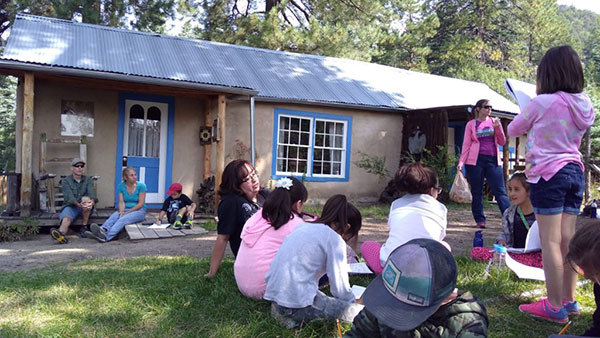 Visiting school children at the Homesteader's Cabin